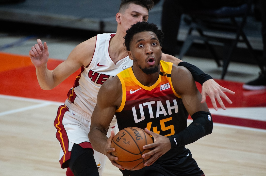 (Francisco Kjolseth  | The Salt Lake Tribune) Utah Jazz guard Donovan Mitchell (45) sees his shot as Miami Heat guard Tyler Herro (14) tries to reach in as the Utah Jazz take on the Miami Heat at Vivint Smart Home Arena in Salt Lake City, on Saturday, Feb. 13, 2021.