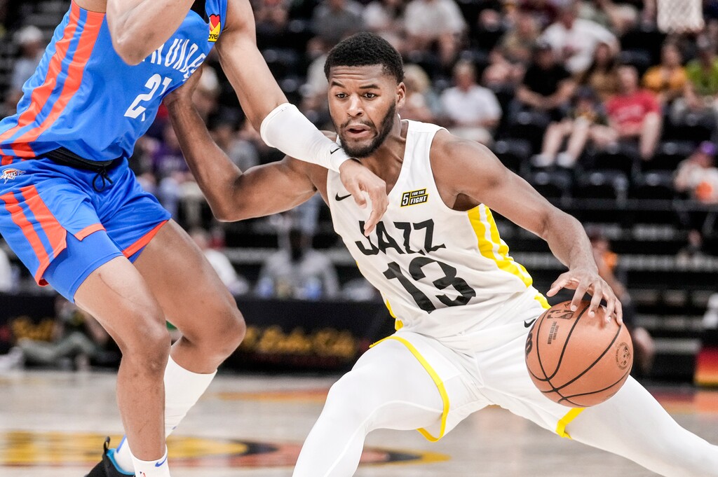 (Leah Hogsten | The Salt Lake Tribune) Utah Jazz guard Jared Butler (13) rounds Oklahoma City Thunder guard Aaron Wiggins (21) as the Utah Jazz host Oklahoma City Thunder during the Salt Lake City Summer League at Vivint Arena, Tuesday, July 5, 2022.