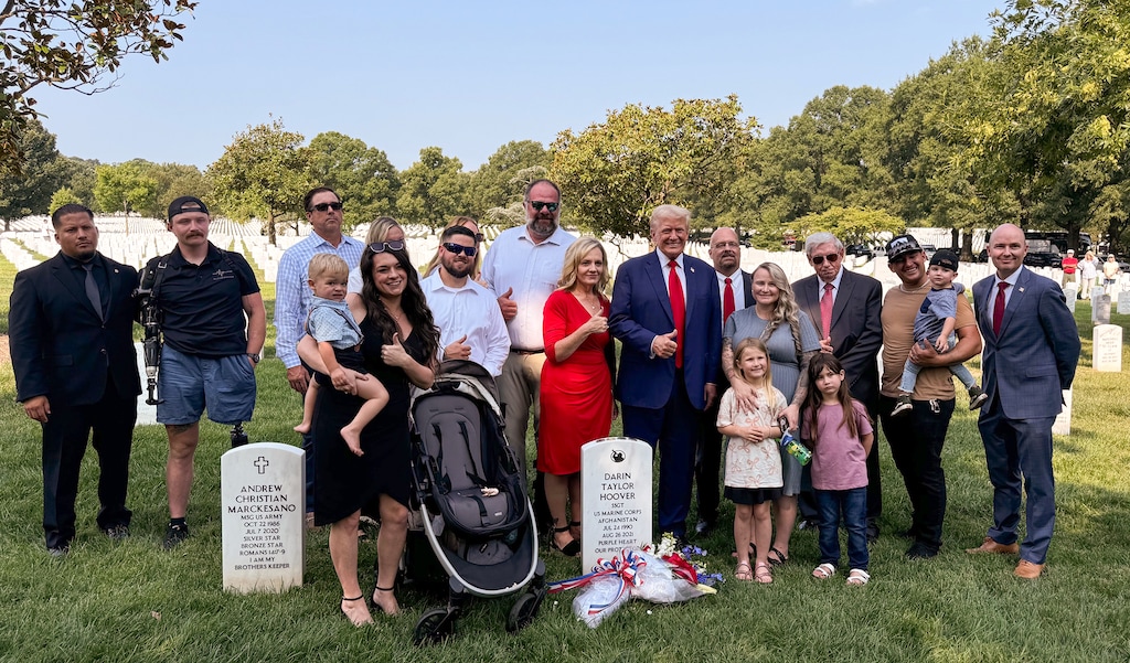 (@GovCox via X) Utah Gov. Spencer Cox, far right, poses for a photograph with the family of Marine Corps Staff Sgt. Darin Taylor Hoover and Republican candidate for president Donald Trump at Arlington National Cemetery in Arlington, Va., Monday, Aug. 26, 2024. Trump and Cox joined the Hoover family to commemorate the passing of Hoover, who was killed three years ago during the U.S. withdrawal from Afghanistan.