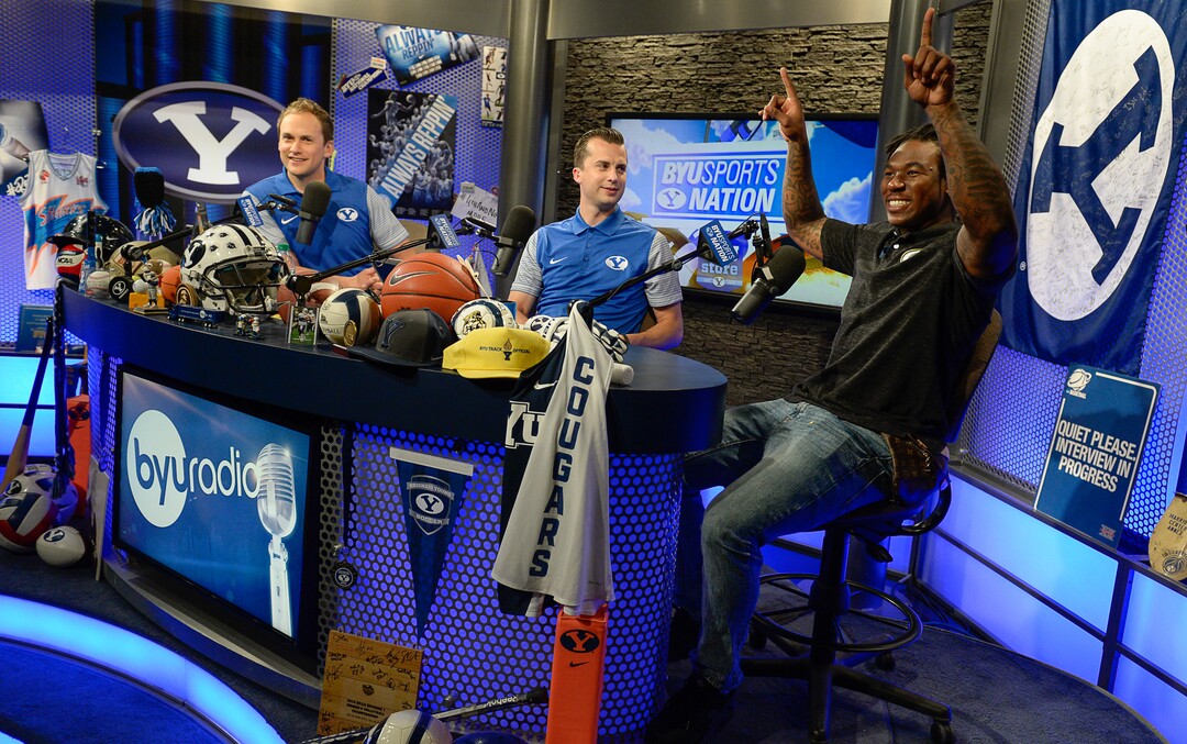 (Francisco Kjolseth  |  The Salt Lake Tribune)  Former BYU football player Jamaal Williams, now with the Green Bay Packers gets on the BYU Radio set with Spencer Linton, left, and Jarom Jordan, center, as BYU hosts their eighth-annual football media day at the BYU-Broadcasting Building on Friday, June 22, 2018.