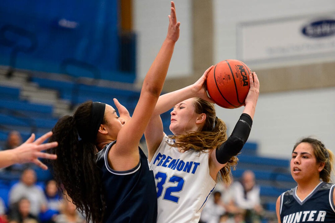 (Trent Nelson | The Salt Lake Tribune)  Hunter's Angel Lui (21) and Fremont's Haylee Doxey (32) as Hunter faces Fremont in the 6A High School Girls' Basketball Tournament at SLCC in Taylorsville, Tuesday Feb. 20, 2018.