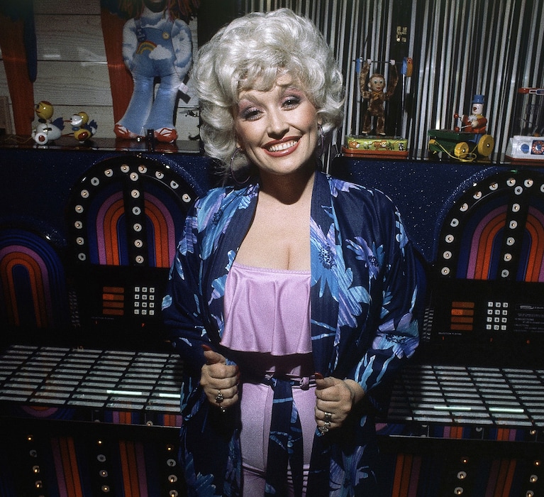 (Harms | AP) Singer and actress Dolly Parton shown at a party following the premiere of her movie "Nine to Five" in Los Angeles, Dec. 12, 1980. Parton died on Aug. 25 at the age of 80. 