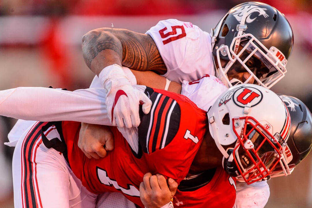 (Trent Nelson | The Salt Lake Tribune)  Utah Utes quarterback Tyler Huntley (1) is sacked by Washington State Cougars linebacker Frankie Luvu (51) and Washington State Cougars defensive lineman Hercules Mata'afa (50) as the University of Utah hosts Washington State, NCAA football in Salt Lake City, Saturday November 11, 2017.