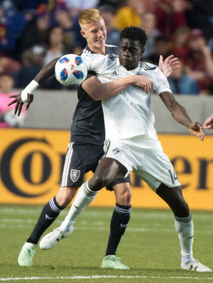 (Rick Egan  |  The Salt Lake Tribune) Real Salt Lake defender Justen Glad (15) goes for the ball along with Colorado Rapids forward Dominique Badji (14), in MLS soccer action, between Real Salt Lake and Colorado Rapids,  at Rio Tinto Stadium, Saturday, April 21, 2018.


