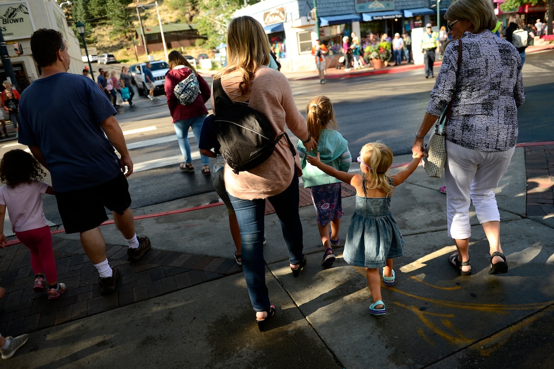 (Helen H. Richardson  |  The Denver Post) Tourists navigate crowded streets as they enjoy walking down West Elkhorn Ave on August 5, 2018, in Estes Park, Colorado. The popular town is overrun with tourists in the summer who come to visit and explore close nearby Rocky Mountain National Park. 
