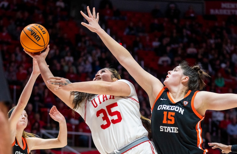 (Rick Egan | The Salt Lake Tribune)  
Utah Utes forward Alissa Pili (35) shoots as Oregon State Beavers guard Lily Hansford (2) and Oregon State Beavers forward Raegan Beers (15)defend, in PAC-12 basketball action between the Utah Utes and the Oregon State Beavers, at the Jon M. Huntsman Center, on Friday, Feb. 9, 2024.

