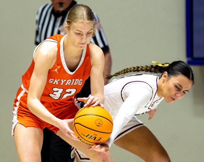 (Rick Egan | The Salt Lake Tribune)  Ellah Oeser (32) Skyridge, goes for a loose ball along with Lone Peak guard Shawnee Nordstrom (3), in the 6A girls Championship Game between Skyridge and Lone Peak, at Weber State, on Saturday, March 4, 2023.
