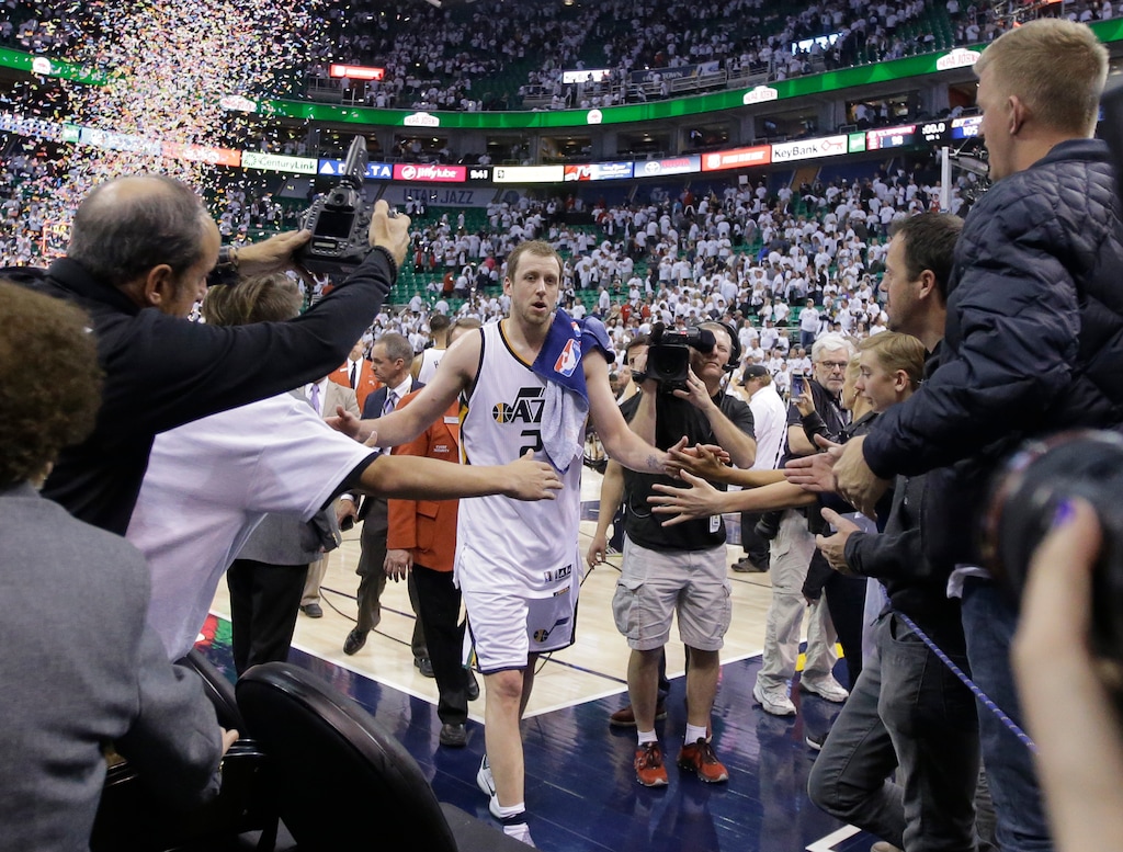 (AP Photo/Rick Bowmer) Utah Jazz forward Joe Ingles (2) receives a high-fives from a fans following Game 4 of an NBA basketball first-round playoff series against the Los Angeles Clippers in April.