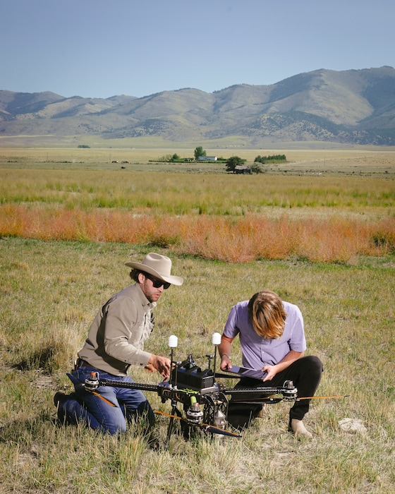 Staff members of Rainmaker, a cloud seeding company based in El Segundo, Calif., prepare a drone for a test flight in southern Idaho, Sept. 17, 2025. States are spending millions of dollars on cloud-seeding technology, backed by new data on its effectiveness — and driven by desperation for water. (Alex Goodlett/The New York Times)
