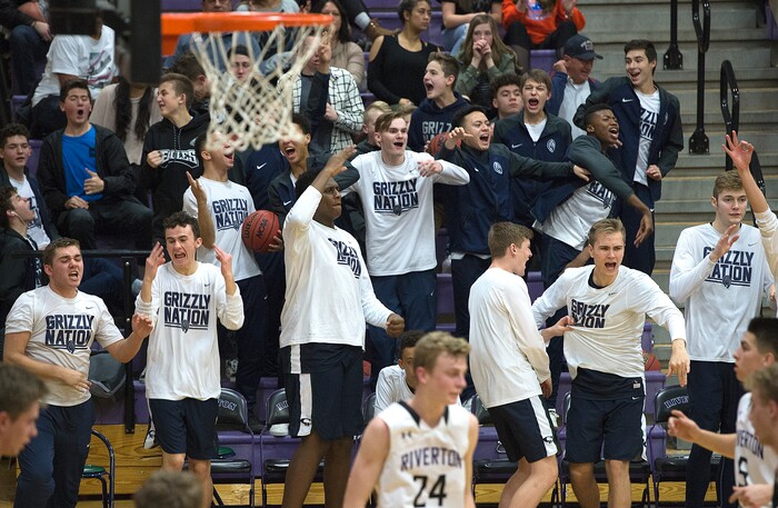 Scott Sommerdorf | The Salt Lake TribuneThe Copper Hills fans and bench enjoys the increased lead late in the game as Copper Hills defeated Riverton 54-50, Friday, February, 2, 2018. 