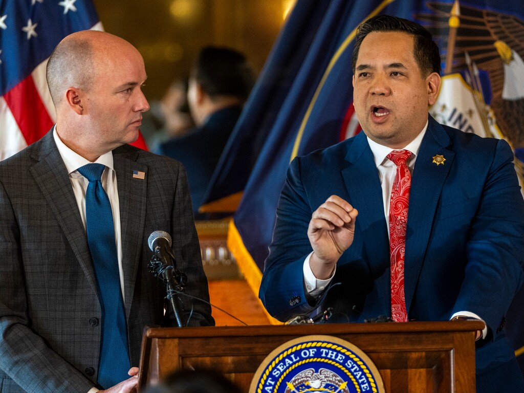 (Rick Egan | The Salt Lake Tribune) Utah Gov. Spencer Cox looks on as Attorney General Sean Reyes talks about pending lawsuits with social media companies to protect the youth, during a news conference at the Capitol, on Monday, Jan. 23, 2023.