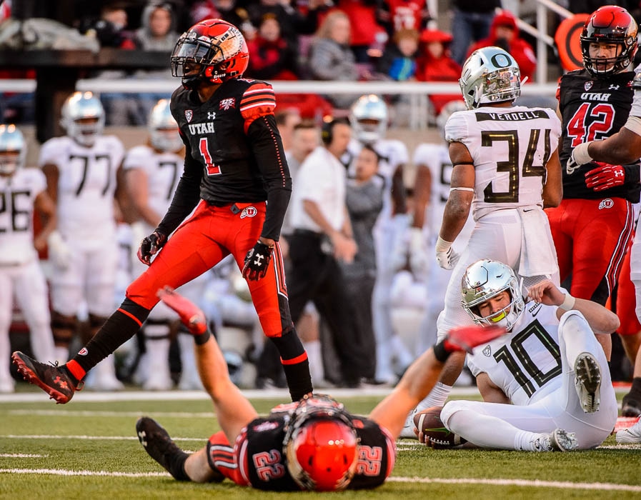 (Trent Nelson | The Salt Lake Tribune)  Utah cornerback Jaylon Johnson (1) celebrates a sack of Oregon quarterback Justin Herbert (10) during the Utes' victory in November 2018.