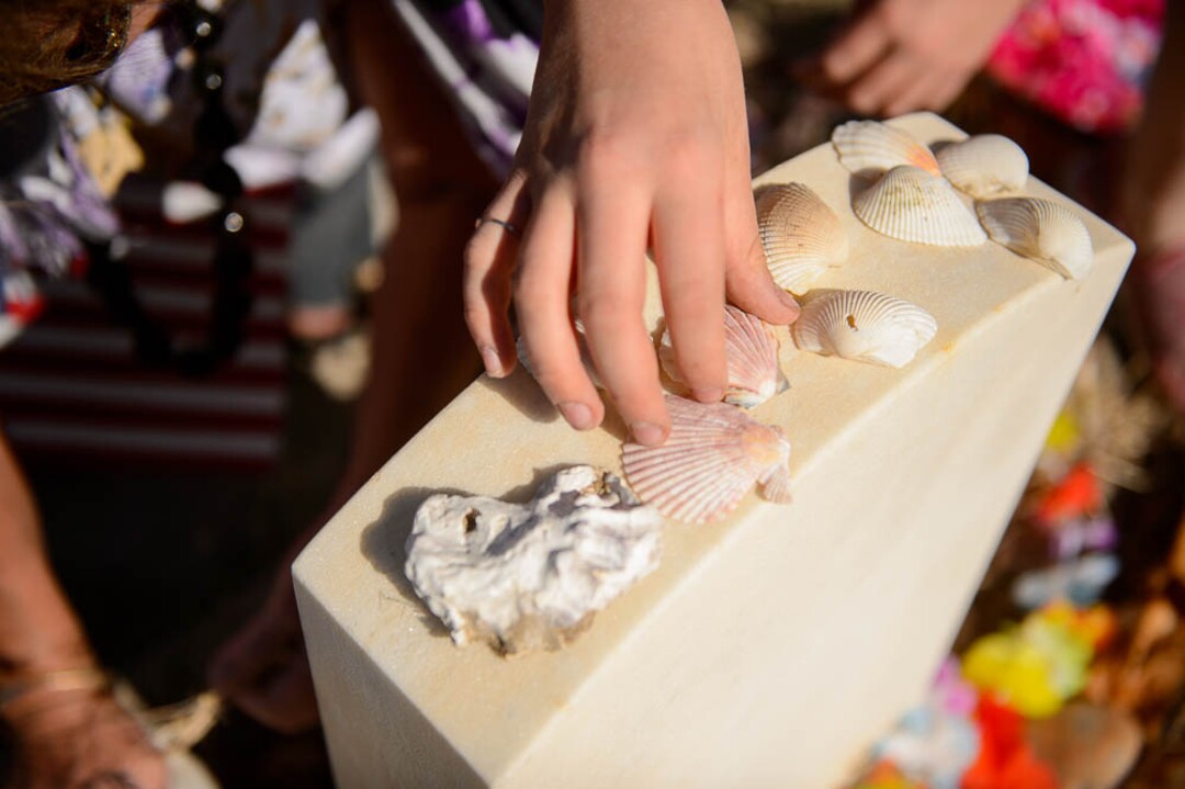 (Trent Nelson | The Salt Lake Tribune)  Descendants of the Hawaiians who settled the desert town of Iosepa took time during their Memorial Day gathering to clean the graves of their ancestors, Saturday May 26, 2018.   Deborah Hoopiiaina and her granddaughter Autumn White decorate the grave of Conie Hoopiiaina (Deborah's uncle).