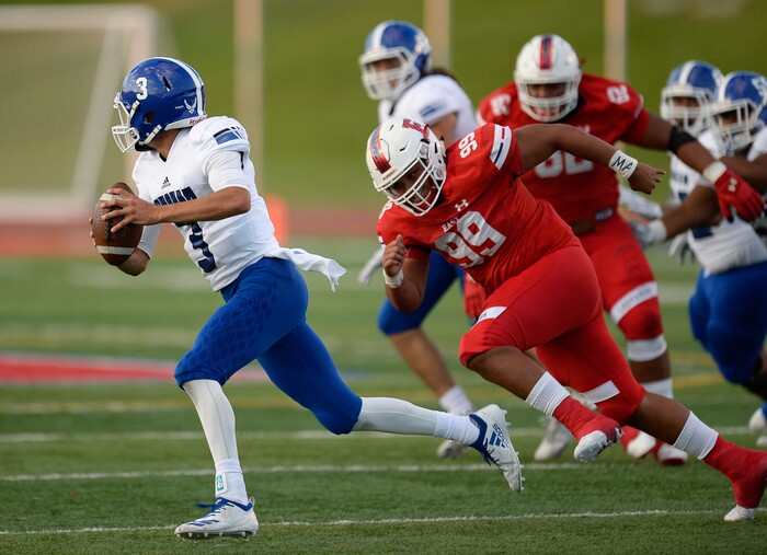 (Francisco Kjolseth  |  The Salt Lake Tribune)  Payton Jones looks for an opening past East in the first half of their game at East on Friday, Aug. 24, 2018.