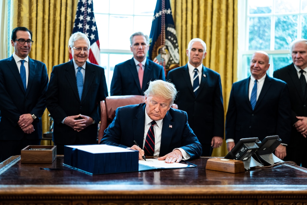 (Erin Schaff | The New York Times)

President Donald Trump signs the coronavirus relief bill in the Oval Office on March 27. "It was Trump’s own party, responding to his leadership or lack thereof, that killed the only praiseworthy aspect of his coronavirus policy," writes Paul Krugman.
