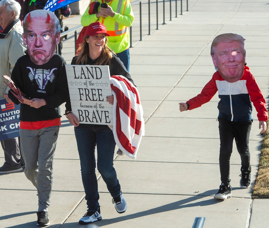 (Rick Egan | The Salt Lake Tribune)  Trump protesters put devil horns on a mask of president-elect Joe Biden as they gather for a rally at the Utah State Capitol on Wednesday, Jan. 6, 2021.