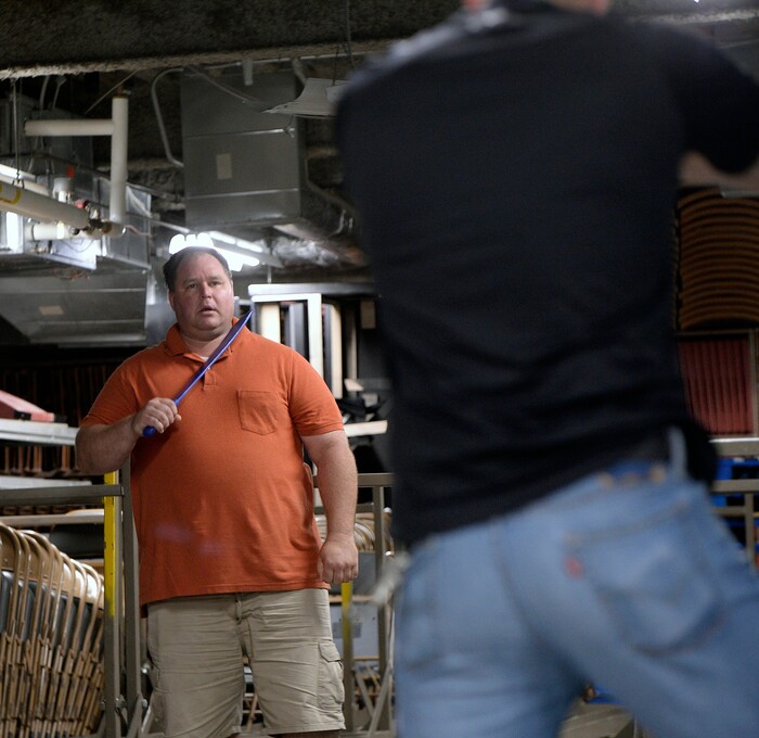 (Al Hartmann | The Salt Lake Tribune)
Dax Shane, a detective assigned to domestic violence with Salt Lake City Police, left, play acts a violent and possibly suicidal man who thinks he is dying of AIDS in a scenario to train new police academy recruits. SLCPD recruit Joel Morgan, right, has his gun drawn because Shane is violent and pulled a large knife threatening to kill himself. A difficult situation taken from real life. Morgan has to de-escalate the situation, calm the person down while still protecting himself. The Salt Lake City Police Department hosted a Crisis Intervention Team (CIT) Academy for police officers and police trainees Thursday, May 10, 2018. The academy provides training for officers and recruits to to learn about and identify signs of citizens who are experiencing a mental health crisis.