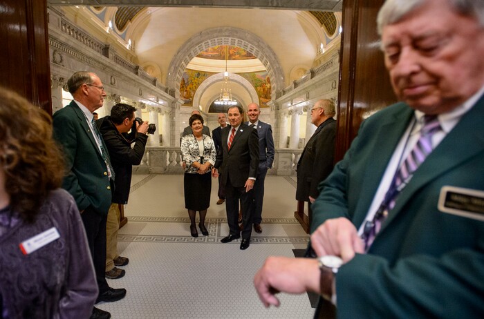 (Steve Griffin  |  The Salt Lake Tribune) Sergeant at Arms Mike Mitchell, right, checks his watch as Gov. Gary Herbert and First Lady Jeanette Herbert along with Utah Lt. Governor Spencer J. Cox and his wife Abby, arrive at the Utah House of Representatives prior to the governor's televised State of the State address in Salt Lake City Wednesday January 24, 2018.