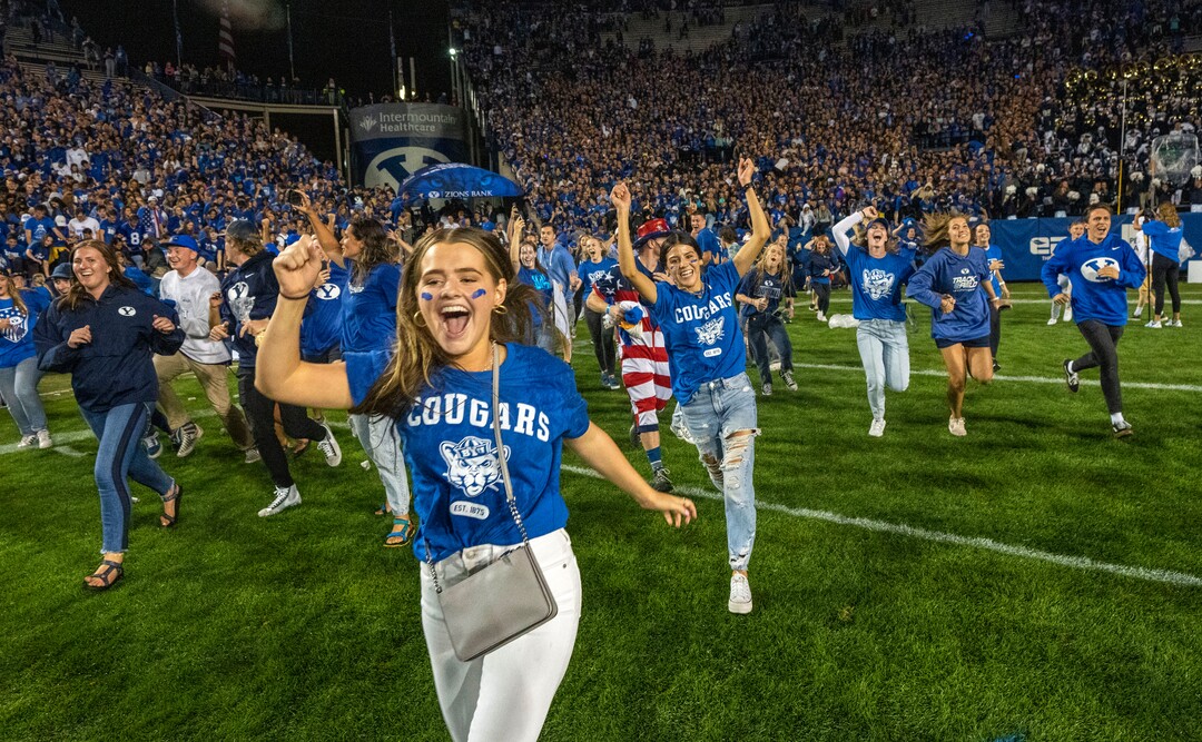 (Rick Egan | The Salt Lake Tribune) BYU fans storm the field as the Brigham Young Cougars defeat the Utah Utes 26-17, at Lavell Edwards Stadium in Provo, on Saturday, Sept. 11, 2021.