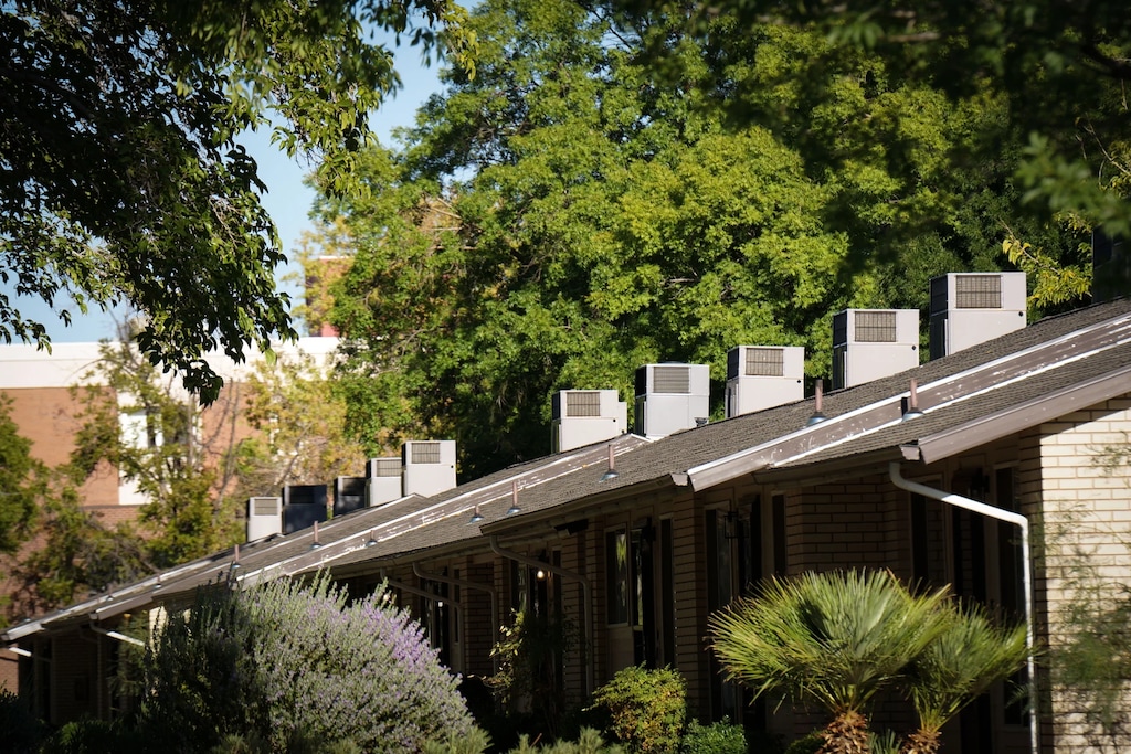 (David Condos | KUER)
Air conditioners line the roof over a set of townhomes in St. George, Utah, Aug. 26, 2026.