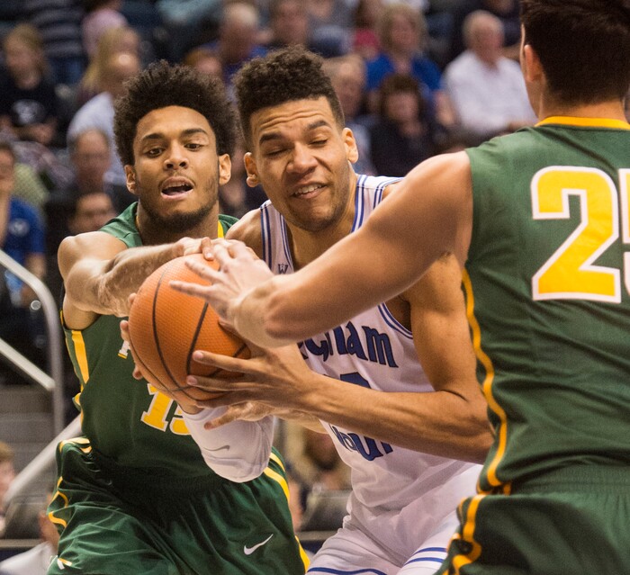 (Rick Egan  |  The Salt Lake Tribune)  Brigham Young Cougars forward Yoeli Childs (23) tries to get past San Francisco Dons forward Nate Renfro (15) and San Francisco Dons guard Jordan Ratinho (25), in basketball action at the Marriott Center, Saturday, February 10, 2018.