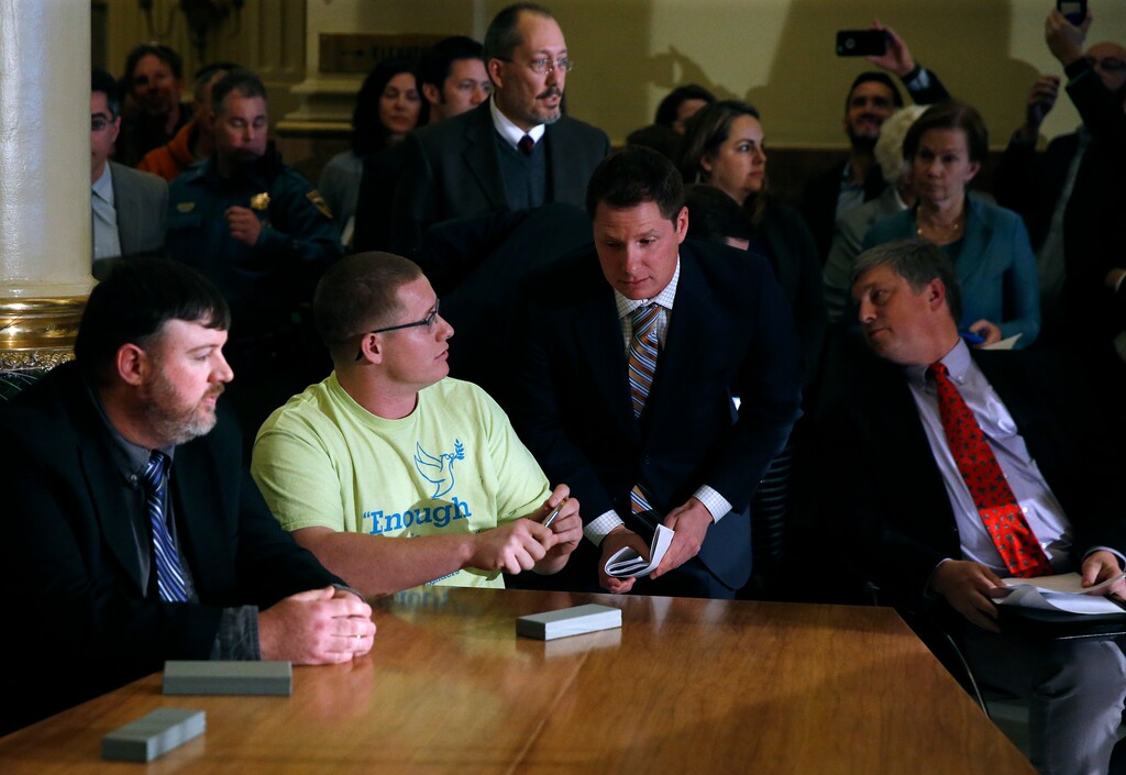 (Brennan Linsley | AP file photo) Colorado elector Micheal Baca, second from left, talks with legal counsel after he was removed from the panel for voting for a different candidate than the one who won the popular vote, during the Electoral College vote at the Capitol in Denver in December 2016. Then-Colorado Secretary of State Wayne Williams, front right, looks on. On Tuesday, Aug. 20, 2019, the 10th U.S. Circuit Court of Appeals ruled that Williams violated the Constitution when he removed Baca from the panel.
