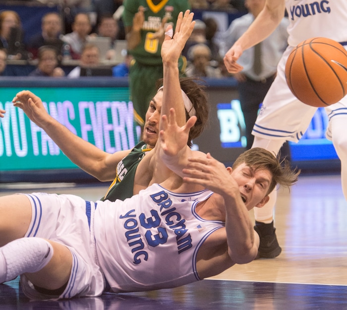 (Rick Egan  |  The Salt Lake Tribune)     Brigham Young Cougars forward Dalton Nixon (33) goes for a loose ball along with San Francisco Dons forward Matt McCarthy (10), in basketball action at the Marriott Center, Saturday, February 10, 2018.