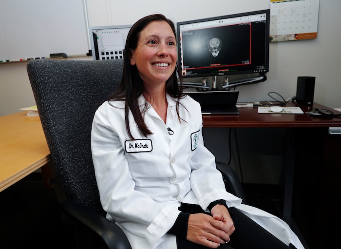 (David Zalubowski | The Associated Press) In this Monday, Nov. 6, 2017, photo, Dr. Stephanie McGrath talks about a study that she is leading to determine the efficacy of using CBD oil in the treatment of dogs with epilepsy at Colorado State University in Fort Collins, Colo. McGrath said she hopes the results will be a stepping stone for longer and more diverse studies, and that they provide useful information for human medicine.