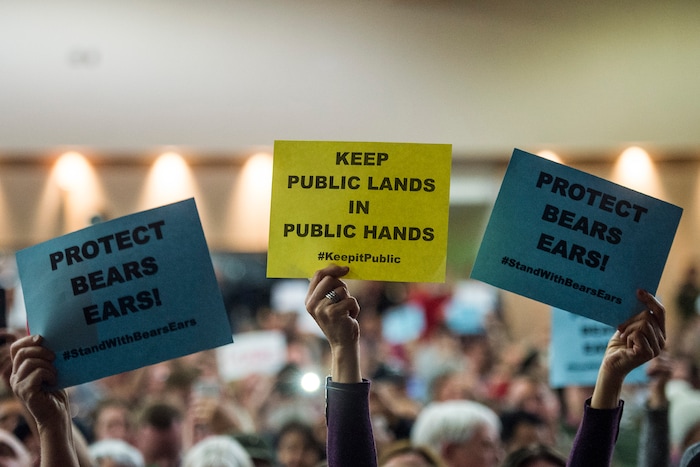 Chris Detrick  |  The Salt Lake Tribune
Members of the audience hold up signs as U.S. Rep. Jason Chaffetz, R-Utah, speaks during the town-hall meeting in Brighton High School Thursday February 9, 2017. 