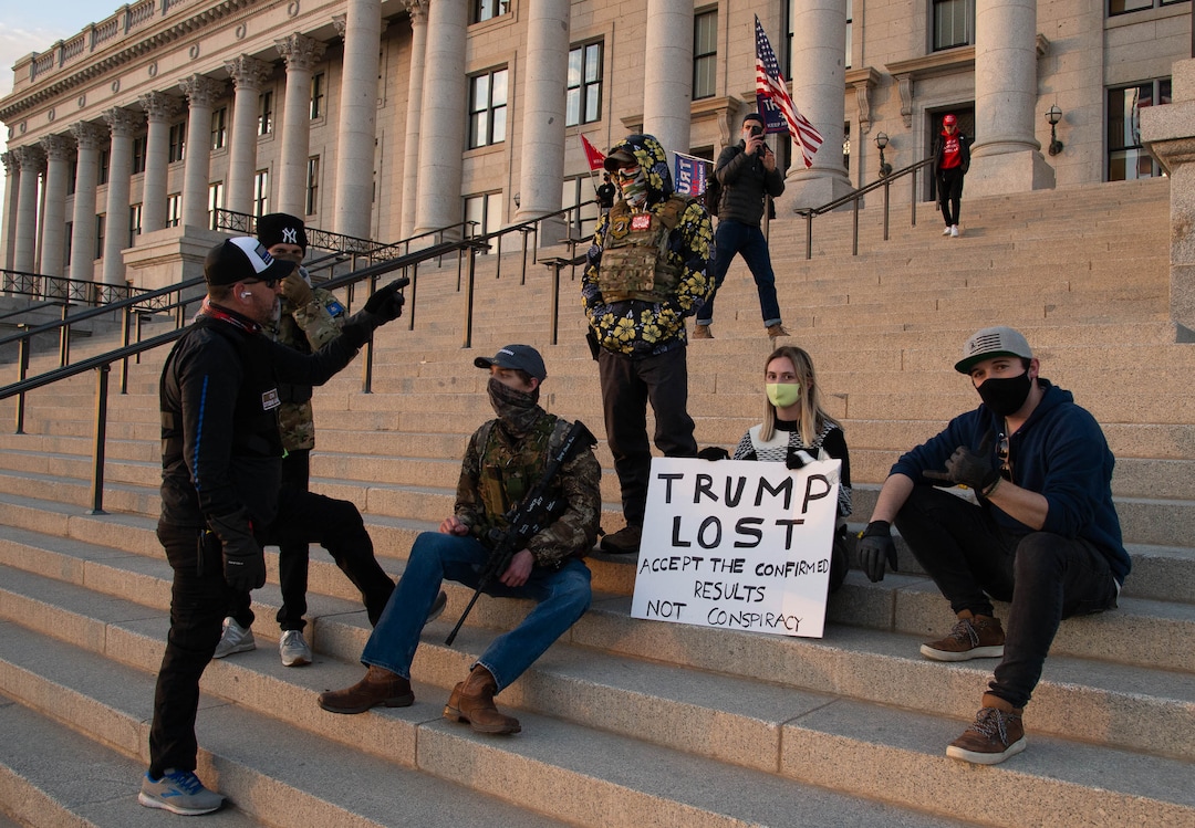 (Francisco Kjolseth  | The Salt Lake Tribune) A member of Utah Citizens Alarm talks with a small group at the Utah State Capitol in Salt Lake City on Wednesday, Jan. 6, 2021.