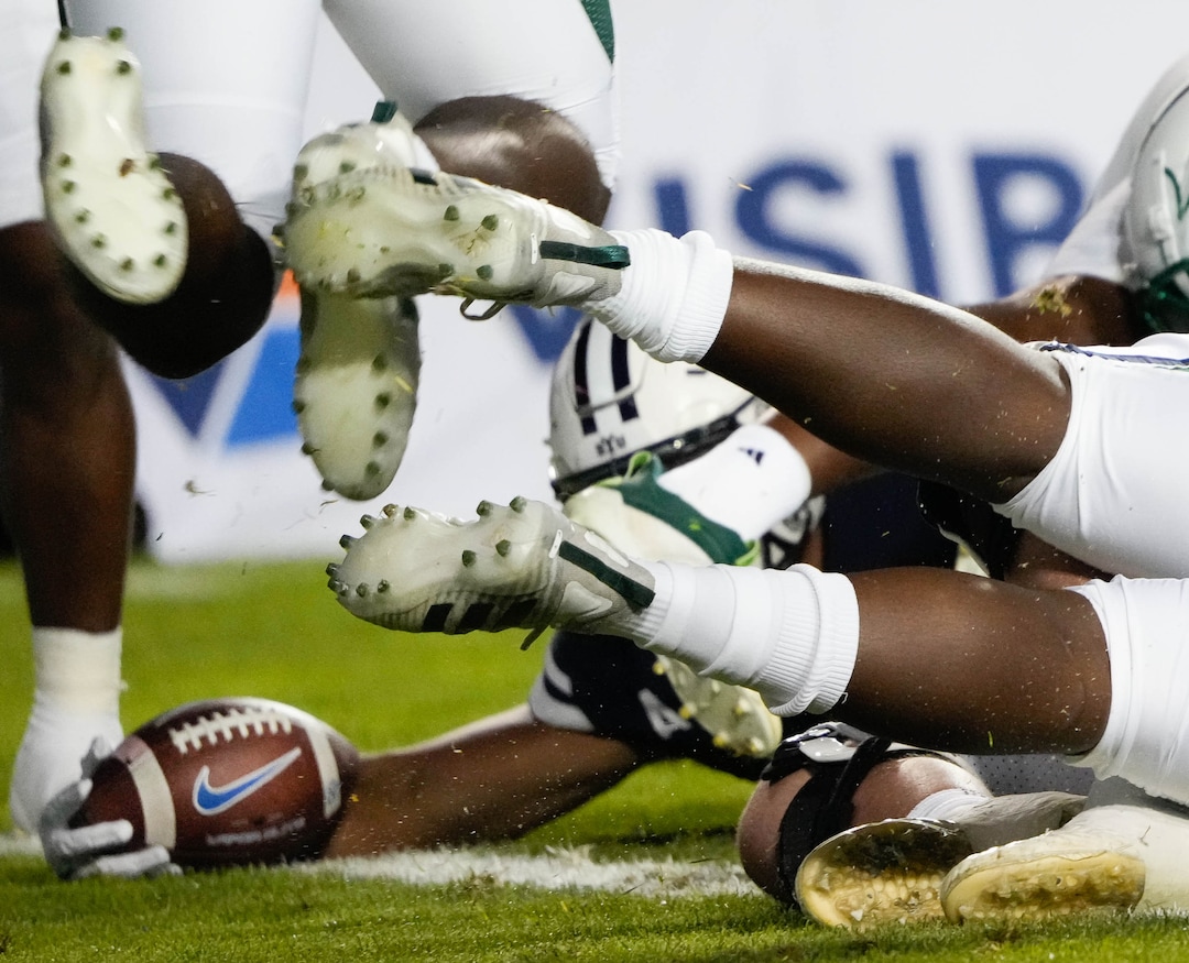 (Francisco Kjolseth | The Salt Lake Tribune) BYU tries to push past the defense for a touchdown in game action between the Brigham Young Cougars and the South Florida Bulls at LaVell Edwards Stadium in Provo, Saturday, Sept. 25, 2021.