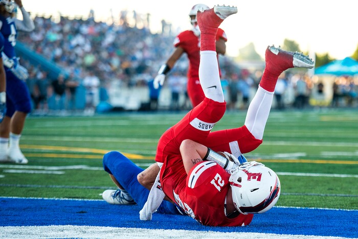 (Chris Detrick  |  The Salt Lake Tribune)  East's Charlie Vincent (21) scores a touchdown during the game at Bingham High School Friday, August 25, 2017. Bingham is winning the game 24-17 at halftime. 