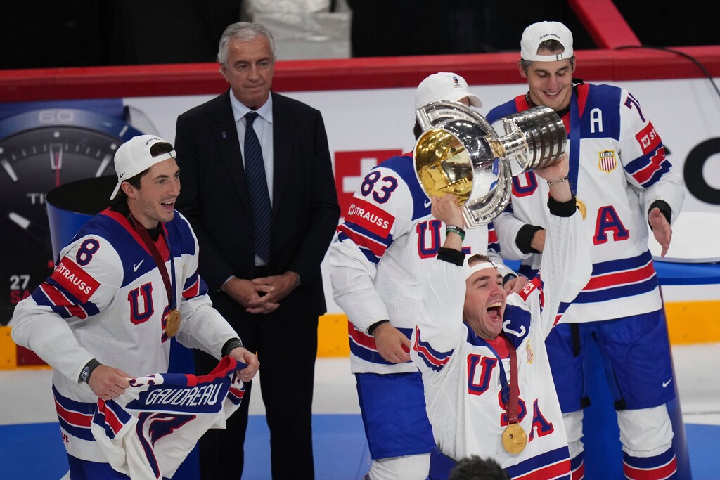 United States' Clayton Keller holds up the tropy after the final match between United States and Switzerland at the ice hockey world championships in Stockholm, Sweden, Sunday, May 25, 2025. (AP Photo/Petr David Josek)