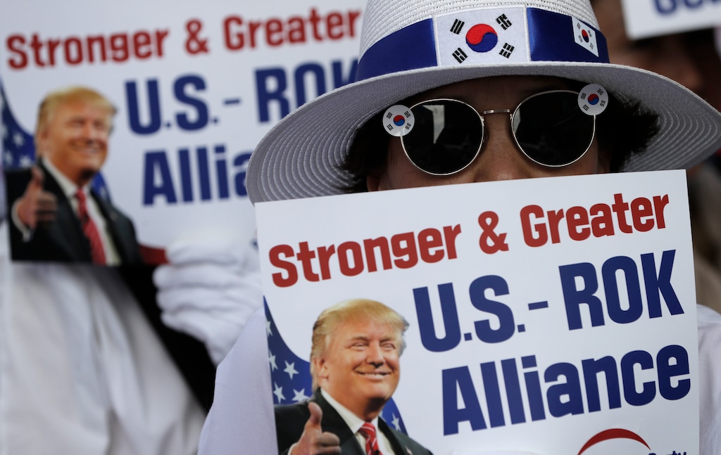 Conservative activists hold signs with a picture of U.S. President Donald Trump during a rally to welcome a planned his visit in Seoul, South Korea, Saturday, June 29, 2019. North Korea said Saturday President Donald Trump's offer to meet leader Kim Jong Un at the Korean Demilitarized Zone is a "very interesting suggestion," brightening prospects for a third face-to-face meeting between the two leaders. (AP Photo/Lee Jin-man)