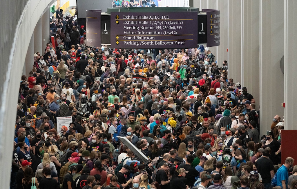 (Francisco Kjolseth | The Salt Lake Tribune) People wait for the doors to open for the FanX Salt Lake Comic Convention as it returns to the Salt Palace Convention Center in Salt Lake City for opening day on Thursday, Sept. 16, 2021. New guidelines, announced on Sept. 2, 2021, require all attendees to wear snug-fitting masks tor rein in the spread of COVID-19.