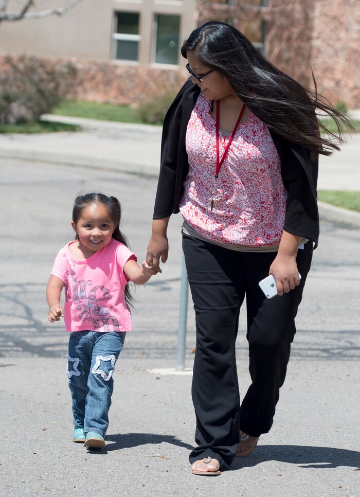 (Rick Egan  |  Tribune File Photo)  Laurel Yellowhorse walks to the playground with her 3-year-old daughter RaeLynn, near the Paiute Tribal office in Cedar City, Wednesday, May 6, 2015.