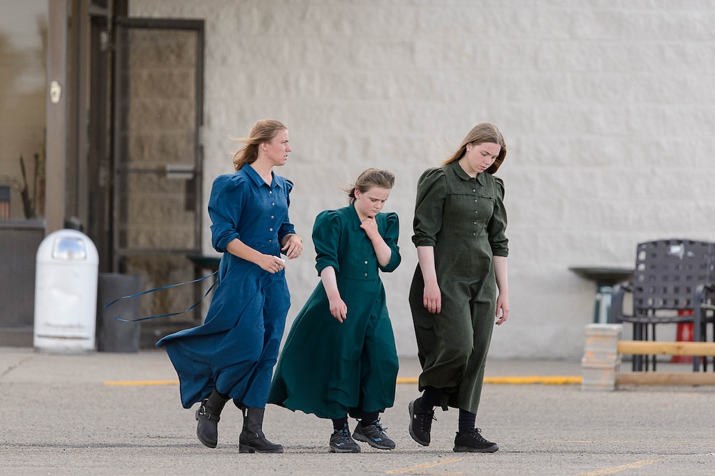 Trent Nelson  |  The Salt Lake TribuneThree young women in fundamentalist prairie dresses in the parking lot of a retail store in Rawlins, Wyoming, Tuesday June 30, 2015.