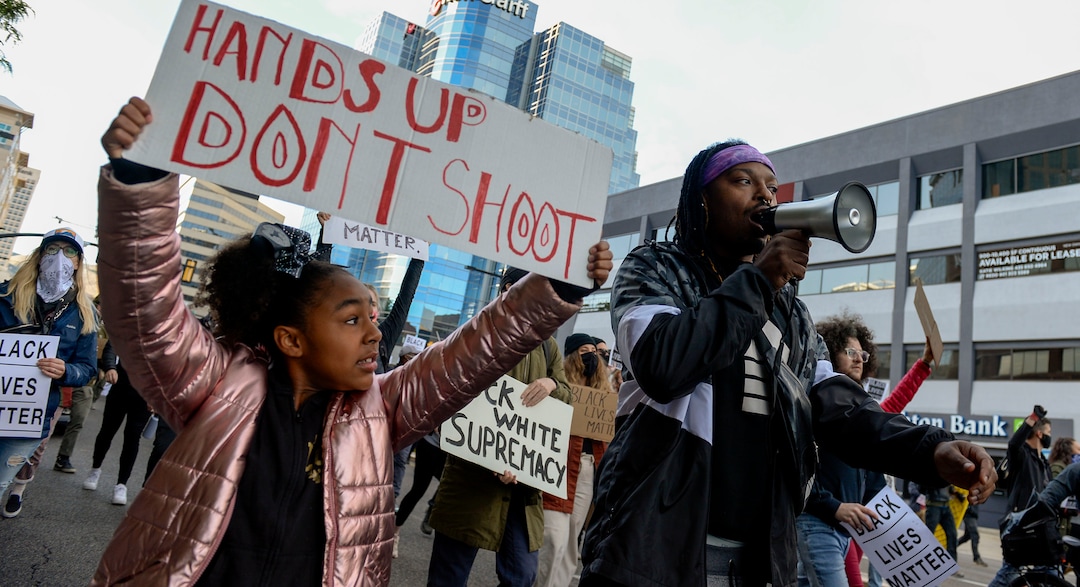 (Leah Hogsten  |  The Salt Lake Tribune) Demonstrators with Black Lives Matter marched from the Utah Capitol down State Street, stopping at every intersection for five minutes in honor of George Floyd, June 8, 2020.