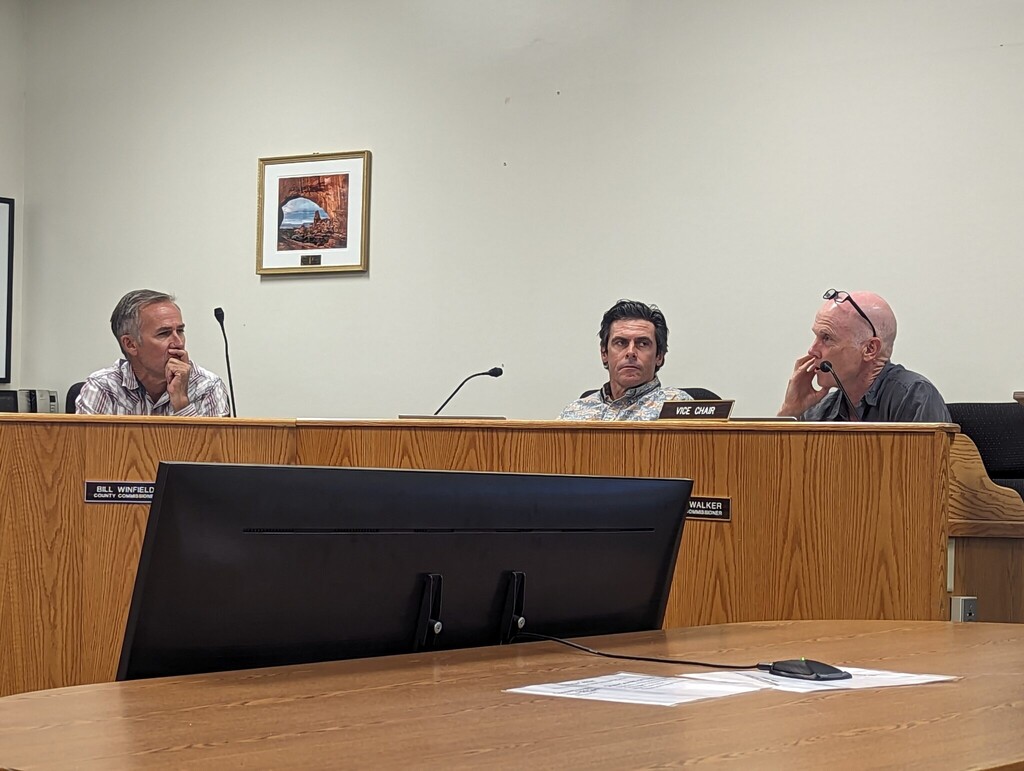 (Andrew Christiansen) Grand County commissioners, from the left, Bill Winfield, Evan Clapper and Kevin Walker discuss Senate Bill 258 at Tuesday’s meeting.