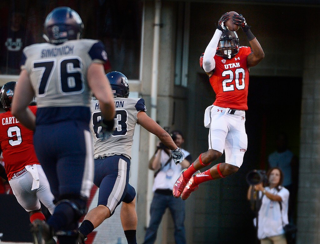 Scott Sommerdorf | The Salt Lake Tribune
Utah Utes defensive back Marcus Williams (20) goes up high to intercept a pass during first half play after USU QB Chuckie Keeton was flushed out of the pocket and threw across the field. Utah and Utah State were tied 14-14 at the half at Rice-Eccles, Friday, September 11, 2015.