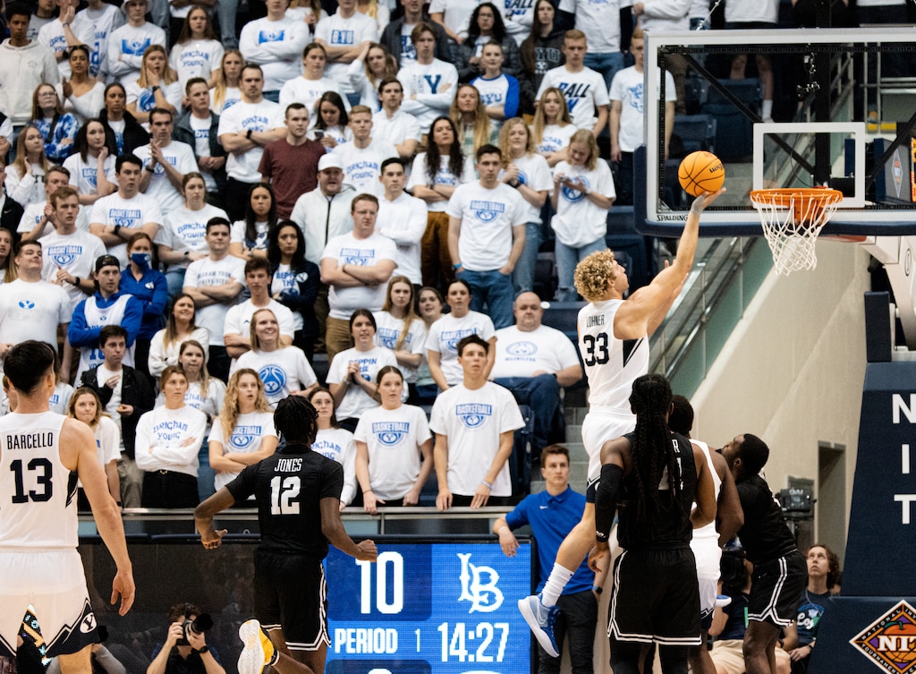 (Rachel Rydalch | The Salt Lake Tribune) Brigham Young Cougars forward Caleb Lohner (33) goes for a layup during a game between the Brigham Young Cougars and the Long Beach State 49ers in the Marriott Center on Wednesday, March 16, 2022.