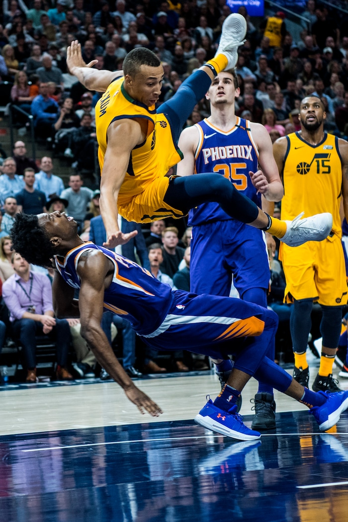 (Chris Detrick  |  The Salt Lake Tribune)  Utah Jazz guard Dante Exum (11) fouls Phoenix Suns guard Josh Jackson (20) during the game at Vivint Smart Home Arena Thursday, March 15, 2018. Utah Jazz defeated Phoenix Suns 116-88.