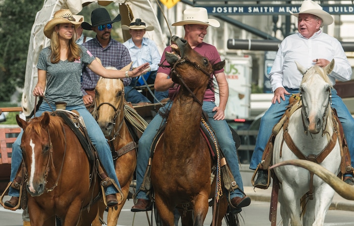(Leah Hogsten | The Salt Lake Tribune) To kick off the start of Utah's Days of '47 rodeo week, Governor Spencer Cox, First Lady Abby Cox and working ranglers drove a herd of longhorn cattle from the heart of Salt Lake City to the  Utah Fair Park, Tuesday, July 19, 2022. 