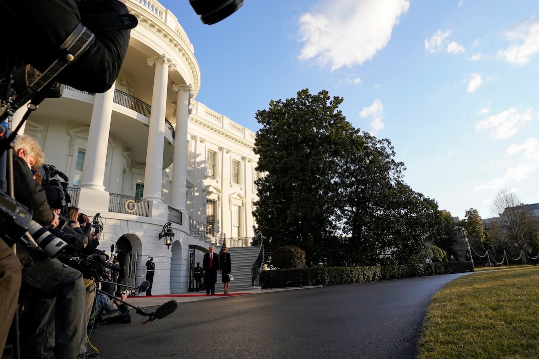 President Donald Trump and first lady Melania Trump leave the White House, Wednesday, Jan. 20, 2021, in Washington. Trump is en route to his Mar-a-Lago Florida Resort. (AP Photo/Evan Vucci)