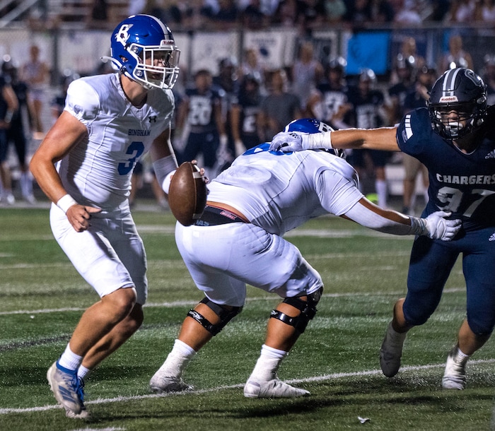 (Rick Egan | The Salt Lake Tribune) Bingham High quarterback Cody Lazenby (3) scrambles with the ball before scoring a touchdown for the Miners, in prep football action between the Corner Canyon Chargers and the Bingham Miners, on Friday, Aug. 27, 2021.