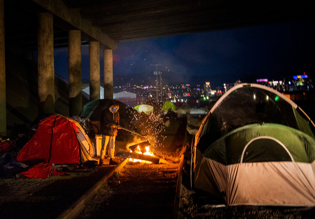 (Rick Egan | The Salt Lake Tribune) People experiencing homelessness seek shelter under the freeway on Saturday, Dec. 12, 2020. A Utah House committee voted 7-1 Thursday in support of a bill that seeks to address problems in the state’s homeless services system.