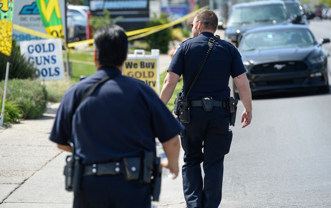 (Francisco Kjolseth  |  The Salt Lake Tribune)  Police work the scene of a shooting at Pawn and Sales, 135 S. and 500 West, in Bountiful on Friday, May 4, 2018, where two men attempted to rob the store. One suspect was killed in a "scuffle" with a staff member while the other one fled the scene.