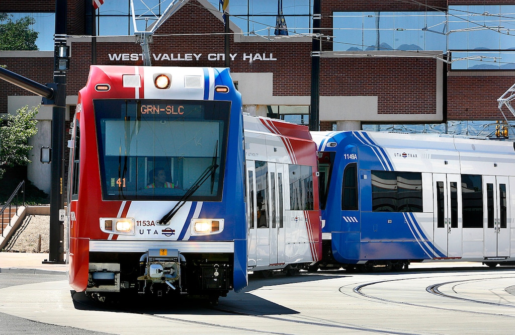 Scott Sommerdorf  |  The Salt Lake Tribune
A TRAX train passes by the West Valley City Hall as it leaves the West Valley Central Station, 2750 W. 3590 South, Sunday, Aug. 7, 2011, the day the new West Valley and Mid-Jordan/University TRAX lines opened.