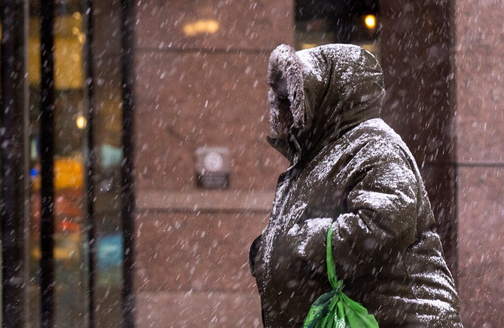 (Rick Egan | The Salt Lake Tribune)   A pedestrian makes his way along 200 South during a snow squall, on Wednesday, Jan. 10, 2024.