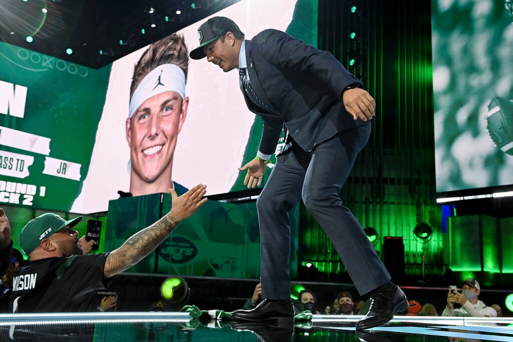 BYU quarterback Zach Wilson, right, greets fans after being selected by the New York Jets with the second pick in the NFL football draft Thursday, April 29, 2021, in Cleveland. (AP Photo/David Dermer)